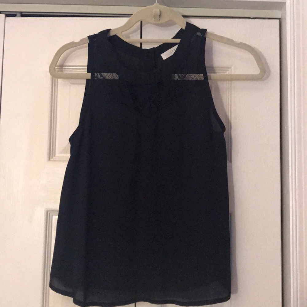 Black tank top with textured front and button back